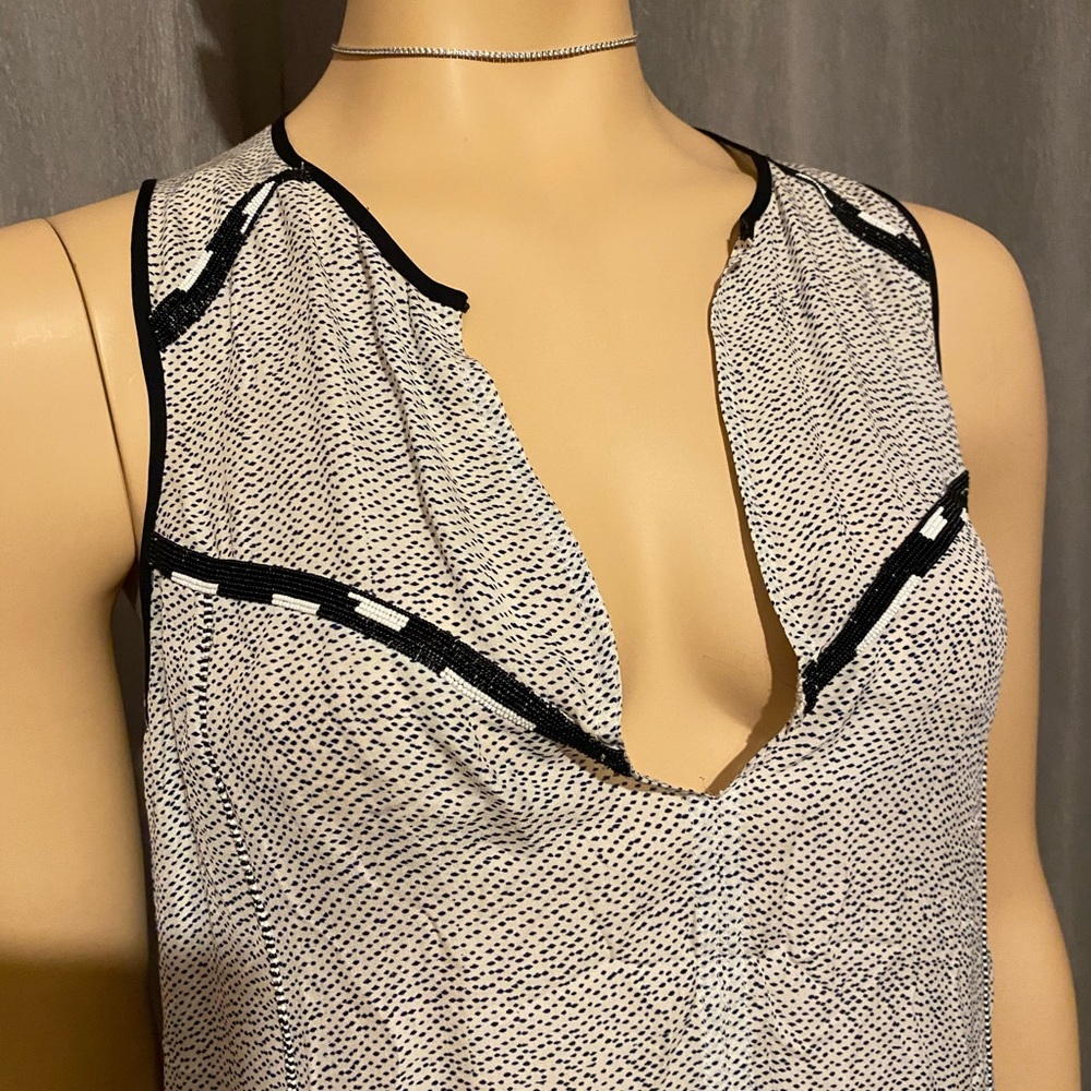High quality silk top with fine beading.